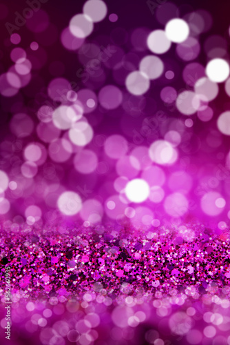 Shiny background. Beautiful glowing bokeh. Bright glowing background. Shiny glowing effect. Purple sequins.