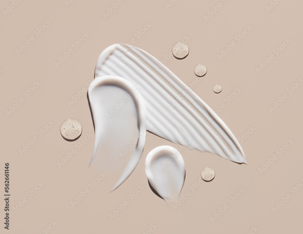 cosmetic smears of creamy texture on a beige background - obrazy, fototapety, plakaty 