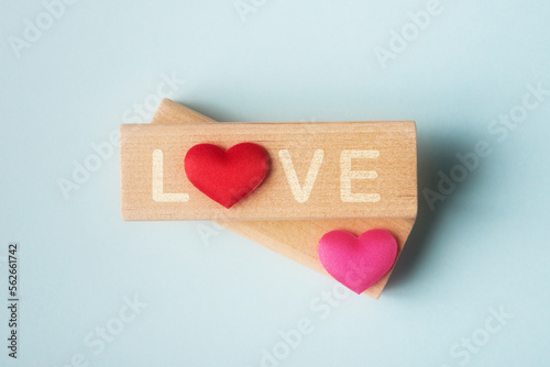 Red hearts and blocks with word Love. Valentine’s day greeting idea