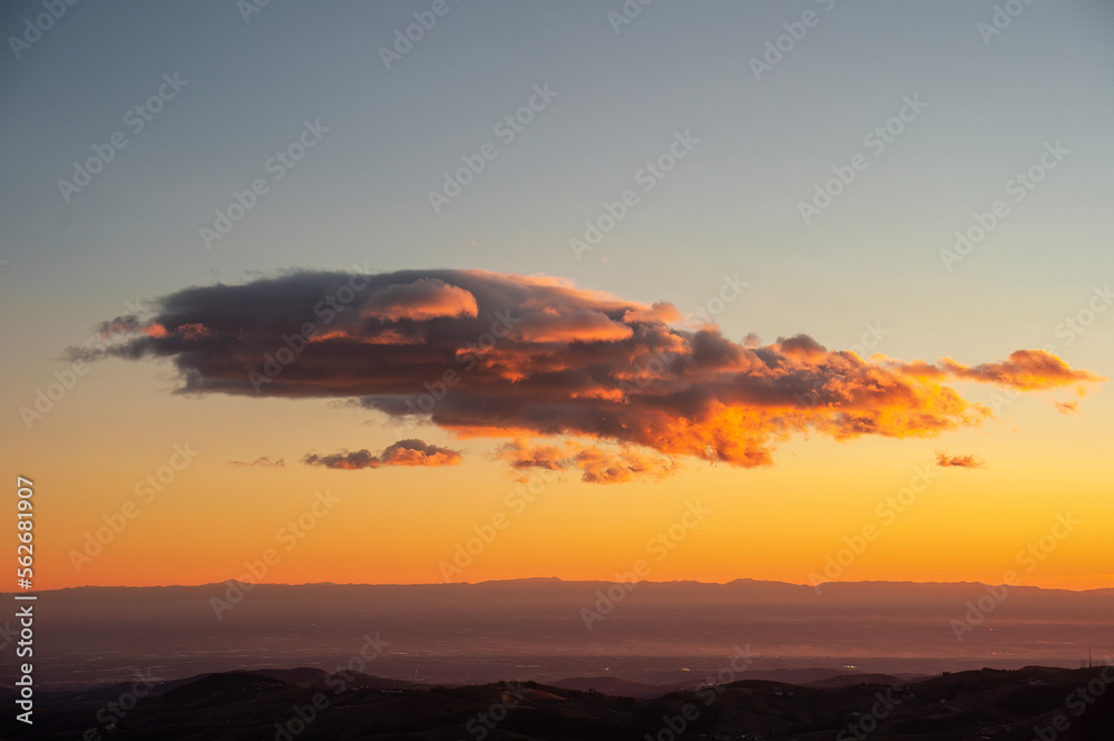 Beautiful mountain sunset with red clouds