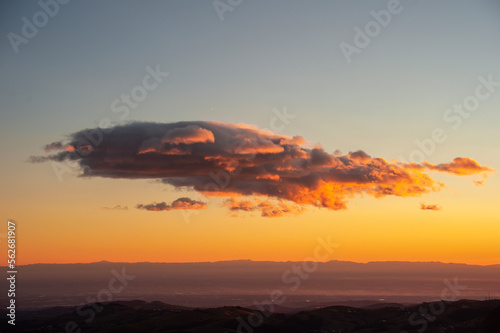 Beautiful mountain sunset with red clouds © oigro