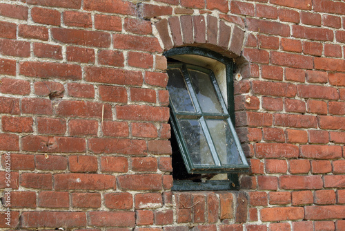 A small window in the old barn of a farm
