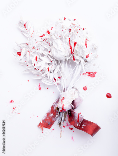White-red bouquet of flowers with bloody streaks. Texture of white flowers with red blood drops on a white background. White light template for text.