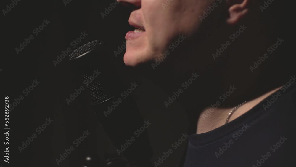 a man speaks into a microphone for a long time in a recording studio. High quality Full HD video recording a man speaks into a microphone for a long time in a recording studio. High quality Full HD video recording