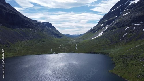 Valley with a river into a lake