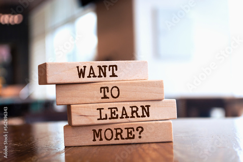Wooden blocks with words 'Want to Learn More?'. photo