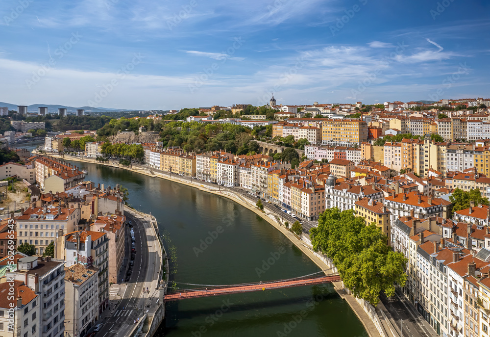 The drone aerial view of Saone River runs through the downtown district of Lyon, France.