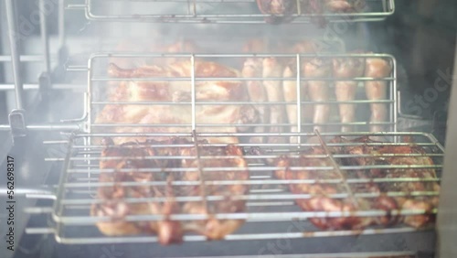 duck grilled on charcoal stove with smoke, asian style street food