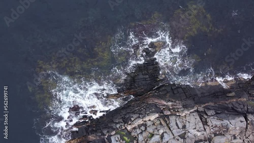Cliffs on the coastline with breaking waves