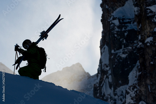 Silhouette of skier hiking. photo