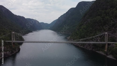 Driving with a camper van over an empty bridge above a fjord