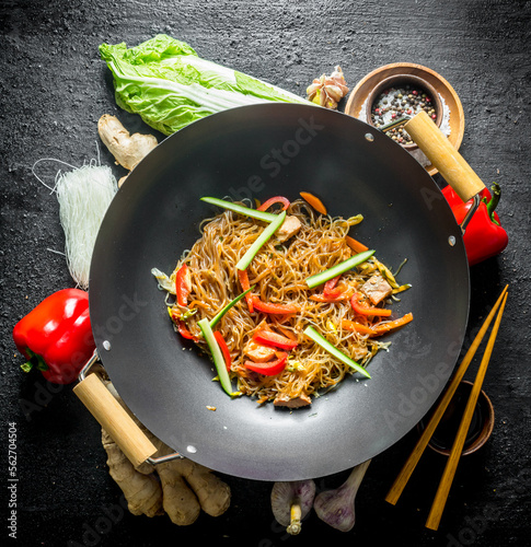 Chinese wok. Ingredients for cooking funchoza with vegetables. photo