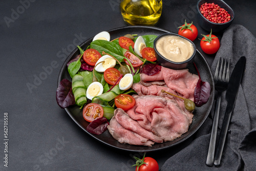 Roast beef with spinach salad and quail eggs healthy lunch keto diet food