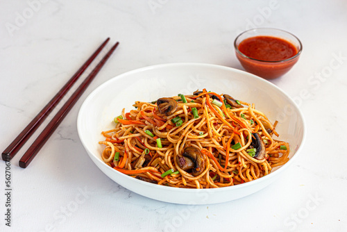 Asian Stir Fried Chow Mein with Sauce Low Angle Food Photo on White Background