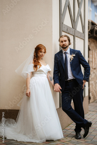 young couple bride and groom in a white dress