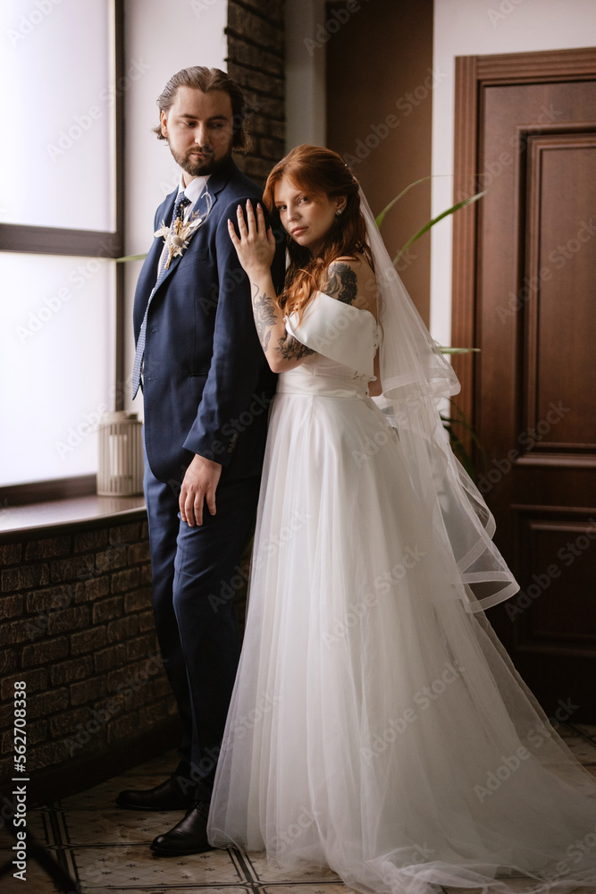 young couple bride and groom in a white dress young couple bride and groom in a white dress