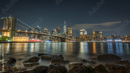 Classic view of Brooklyn Bridge and Manhattan from Pebble Beach in Brooklyn
