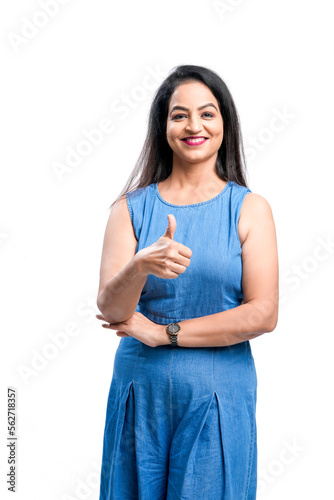 Indian woman showing thumps up on white background. © Niks Ads