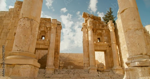 Establishing side of Artemis Temple Esplanade with columns in front in Jerash, Jordan. Ancient sanctuary and former Roman ruins and one of Seven Wonders. Antique architecture. 4k orbit shot photo