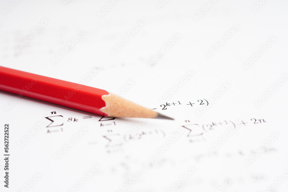 Pencil on mathematic formula exercise test paper in education school. Pencil on mathematic formula exercise test paper in education school.
