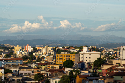 Amazing metropole with houses on small hills and horizon with mountains