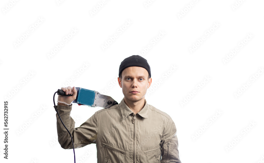 male plumber with a polypropylene pipe soldering iron on a white background. male plumber with a polypropylene pipe soldering iron on a white background.