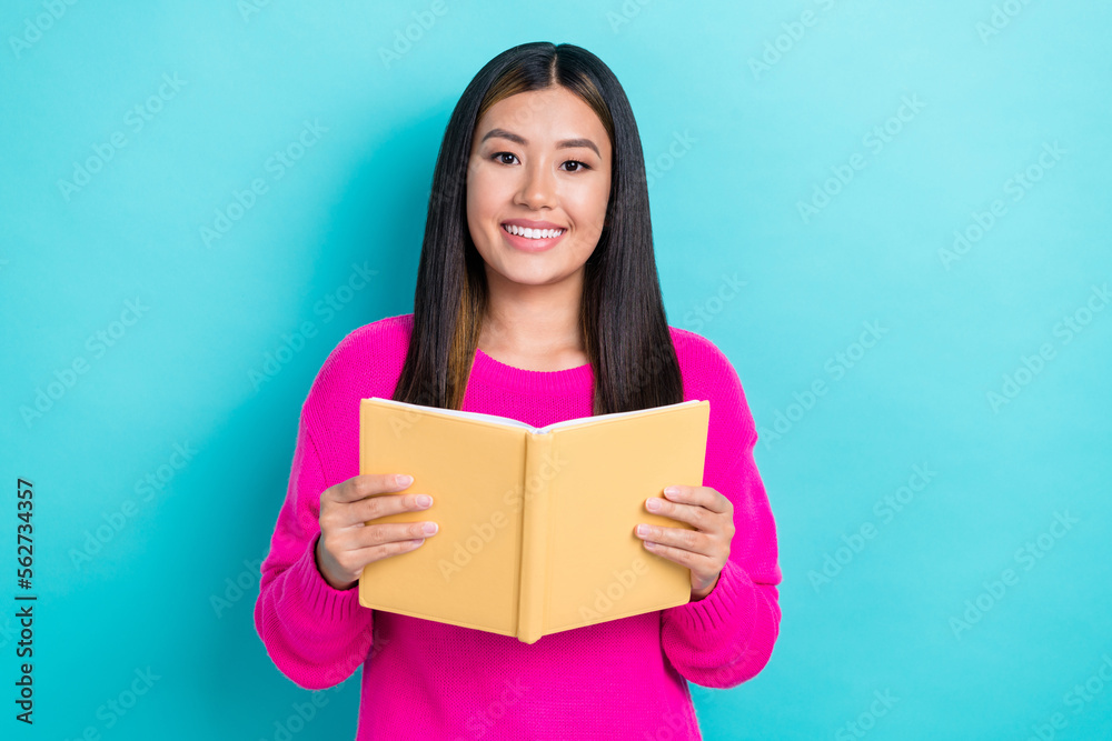 Photo of pretty cute lady wear pink clothes hands hold book diary planner preparing exam isolated on cyan color background Photo of pretty cute lady wear pink clothes hands hold book diary planner preparing exam isolated on cyan color background
