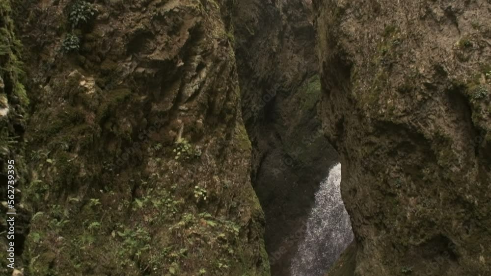 Water flows from a waterfall, slow motion.
Water flows from a waterfall, slow motion.
