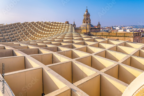 View from the top of Las Setas in Seville with old Spanish church tower in the background