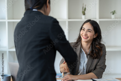 Two Asian businesswomen showing joy and shake and Cheerful Success with New job offer, job promotion. Management. Performance, management concept.