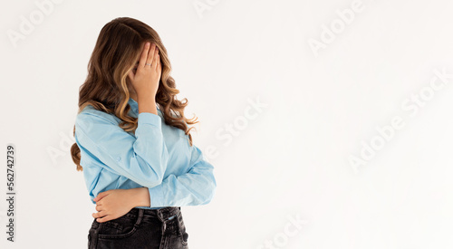 God why me. Portrait annoyed fed up pissed young woman make facepalm hide face close eyes bend head down bothered, tired explaining simple tasks, standing white background