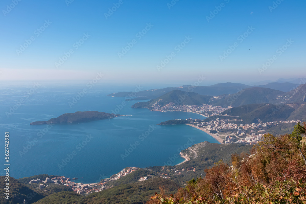 Panoramic aerial view on the coastline of Budva and Sveti Nikola Island seen from Goli Vrh, Adriatic Mediterranean Sea, Montenegro, Balkan, Europe. Luxury hotel resorts along Budvanian Riviera. Panoramic aerial view on the coastline of Budva and Sveti Nikola Island seen from Goli Vrh, Adriatic Mediterranean Sea, Montenegro, Balkan, Europe. Luxury hotel resorts along Budvanian Riviera.