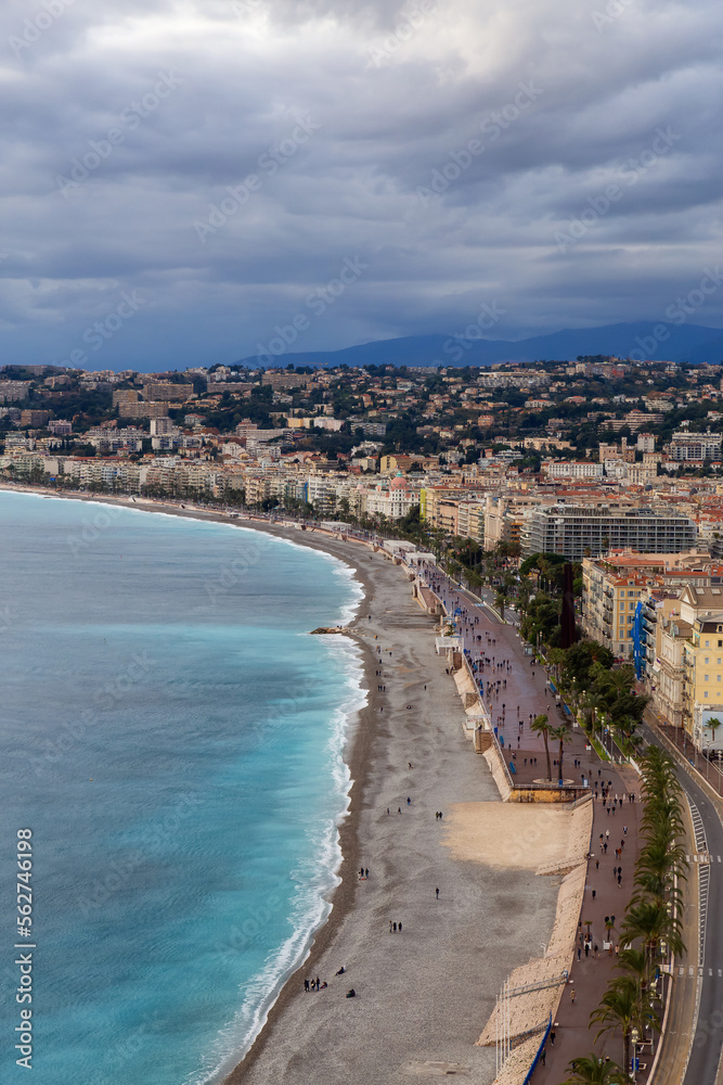 Sandy Beach by Historic City of Nice, France. View from Castle Hill. Cloudy Evening before Sunset.