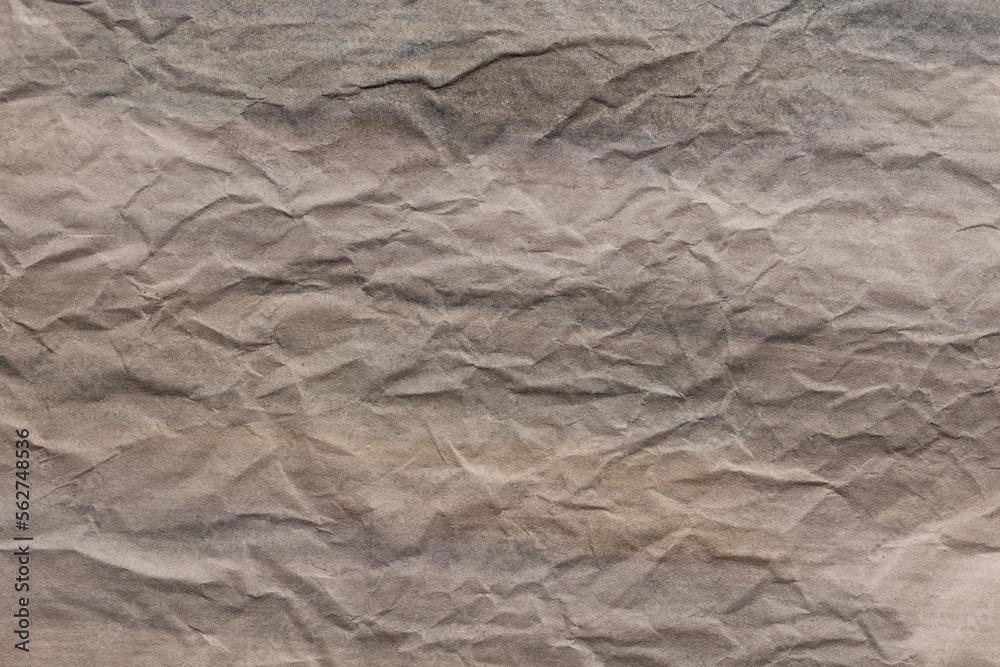 Background in faded washed-down colors with a graphic crumpled surface. Texture, paper, grunge. Background in faded washed-down colors with a graphic crumpled surface. Texture, paper, grunge.