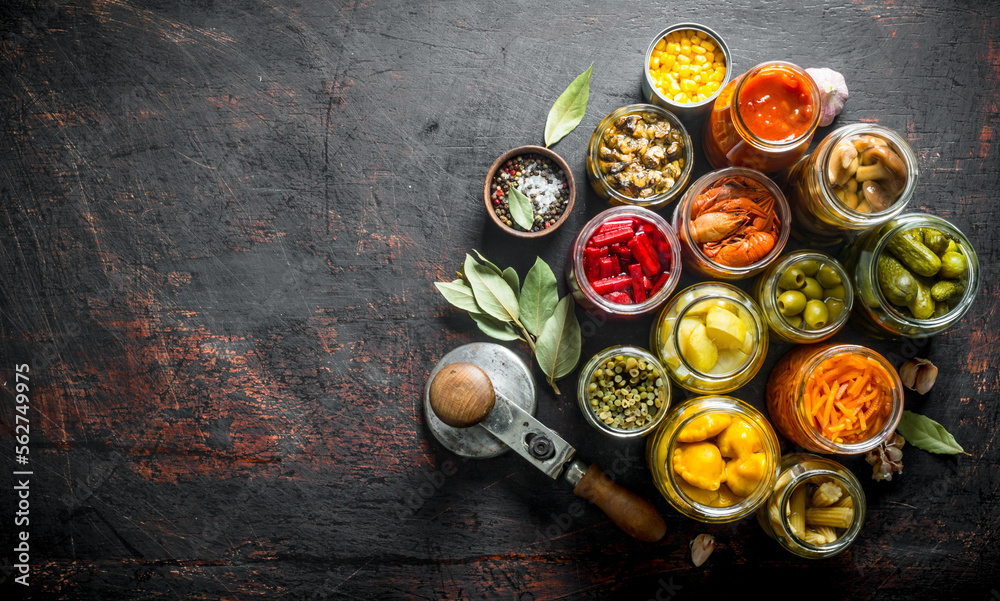 Jars with a variety of pickled food. Jars with a variety of pickled food.