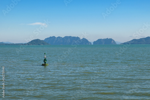 Tropical sea view, landscape from Ko Lanta, Southern Thailand. With green buoy in the foreground.