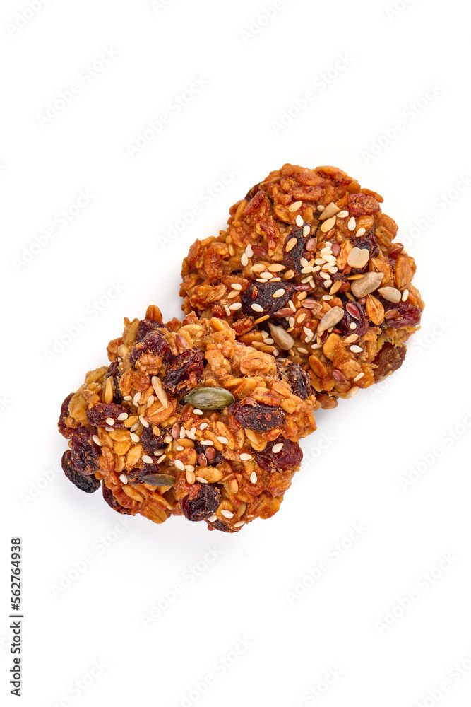 Homemade oat cookies with seeds, isolated on white background.
