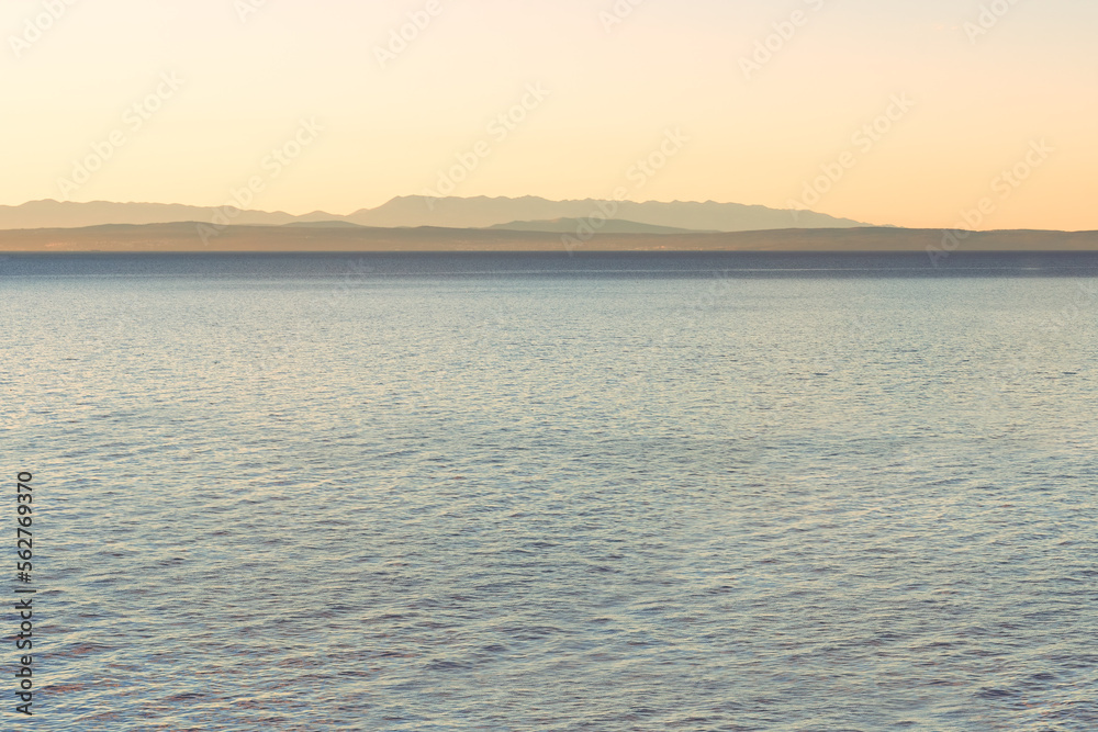 Adriatic sea and island of Cres on horizon seen from the town of Lovran in Croatia Adriatic sea and island of Cres on horizon seen from the town of Lovran in Croatia