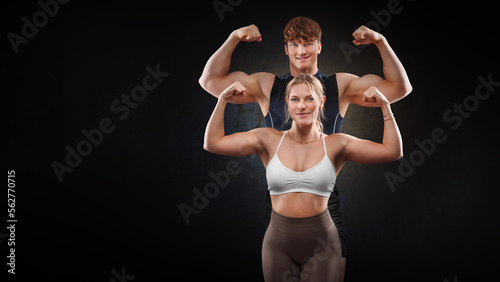 strong and young athletic couple poses for the camera show smiling biceps
