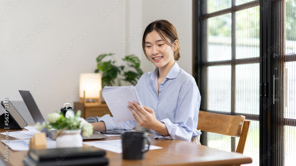 Work from home, College student is analyzing data or doing homework assignments in her house, Use your laptop to search for information and educate yourself at home, Stay home, Internet learning. Work from home, College student is analyzing data or doing homework assignments in her house, Use your laptop to search for information and educate yourself at home, Stay home, Internet learning.
