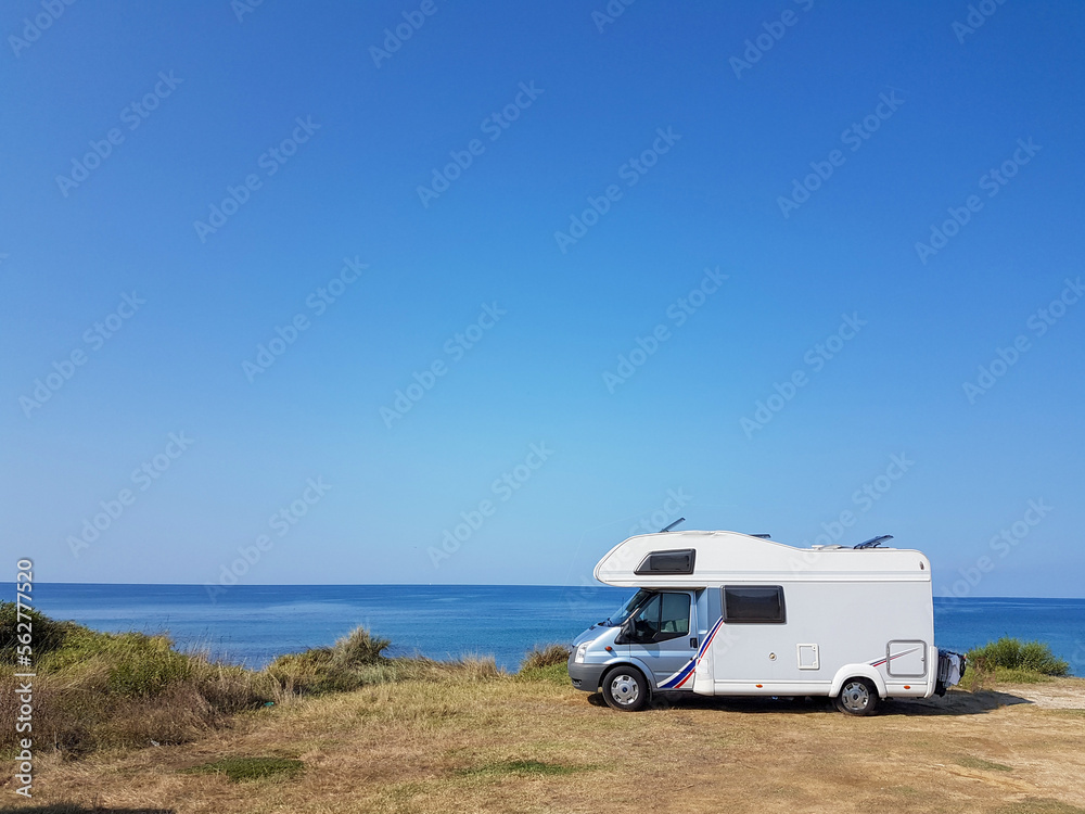 caravan car by the sea and blue sky in summer