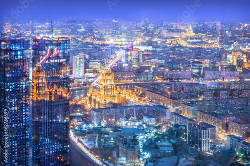 View of the city from the observation deck to skyscrapers in the light of night lights and Hotel, Moscow City