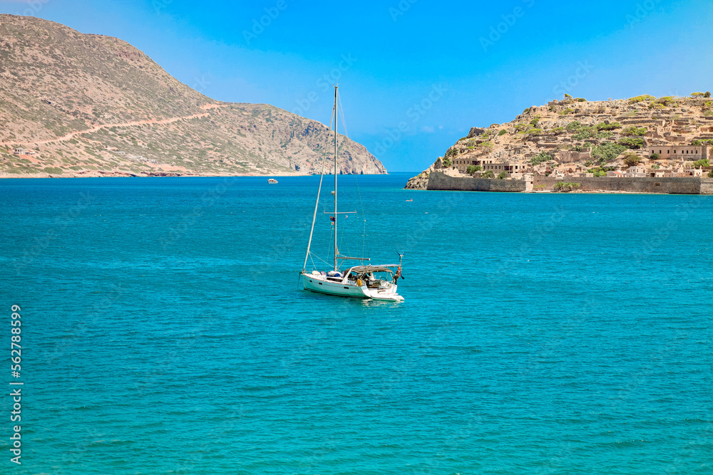 View of the island of Spinalonga with calm sea. gulf of Elounda, Crete, Greece. View of the island of Spinalonga with calm sea. gulf of Elounda, Crete, Greece.
