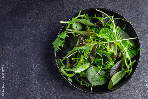 Healthy green salad leaves mix micro green  juicy snack food on the table copy space food background rustic top view