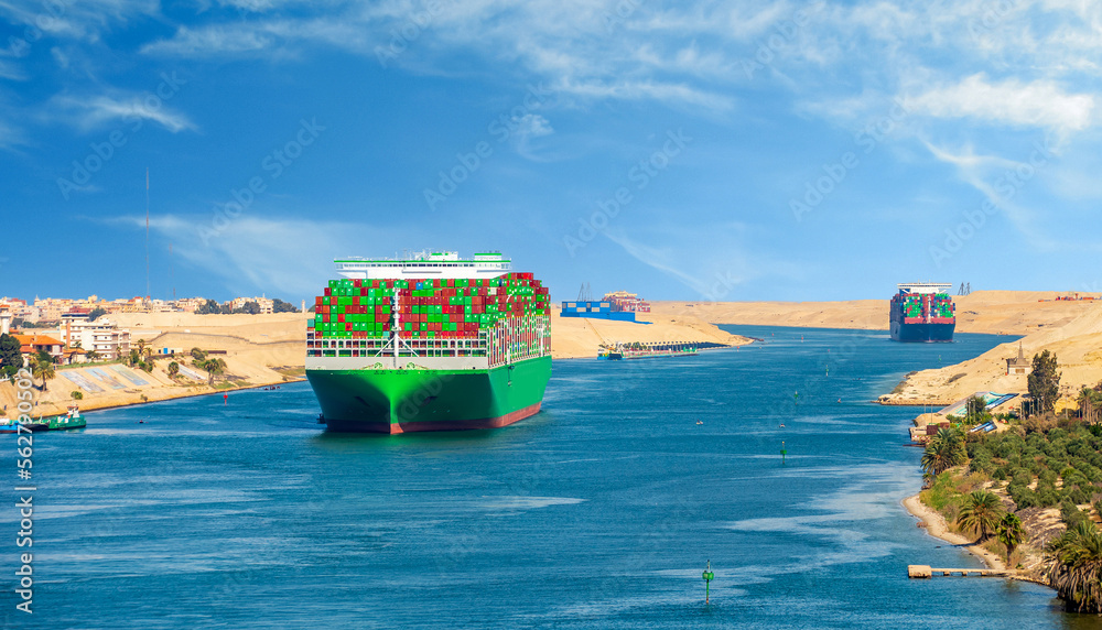 Αυτοκόλλητο Large container ship, accompanied by tugboat, passing through the Suez Canal in Egypt
