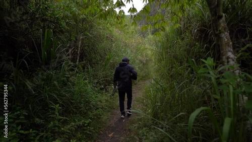 person walking on ecuadorian landscape road up the mountain in slow motion