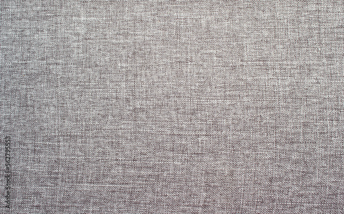 Real gray synthetic fiber fabric with a textured background. Fabric textile background.