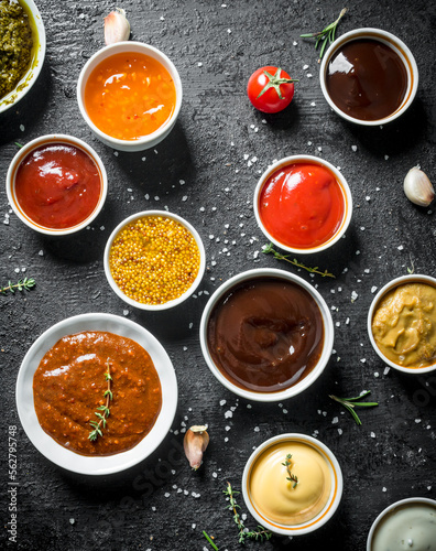 Different kinds of sauces in bowls. photo