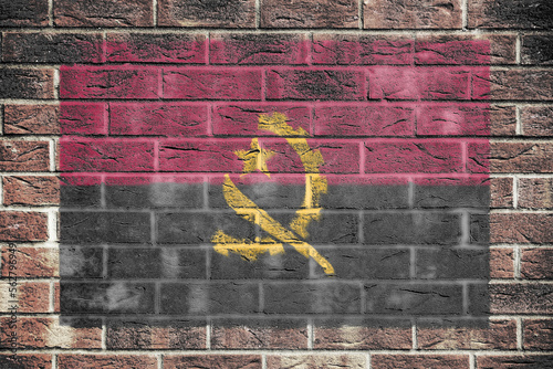 Angola flag on a brick wall background