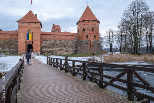 View of Trakai Castle island on Galve lake as seen from the access footbridge, town of Trakai, Lithuania photo